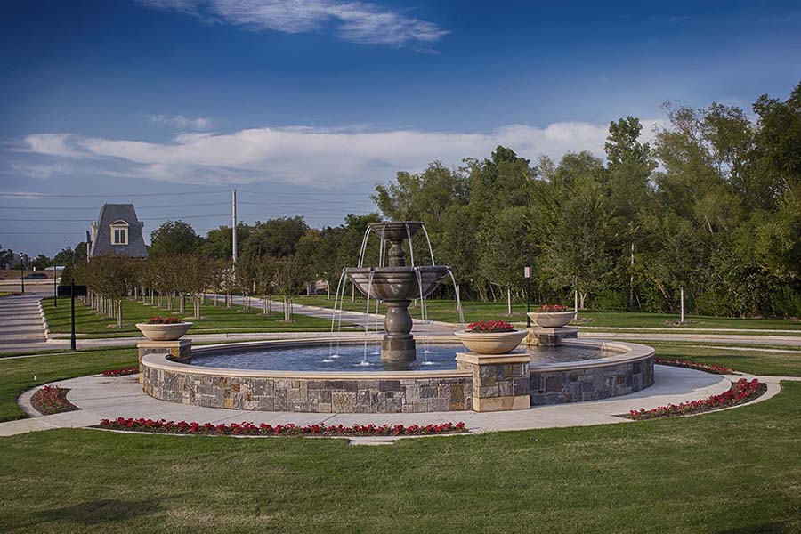 fountain and landscape with tree-lined path